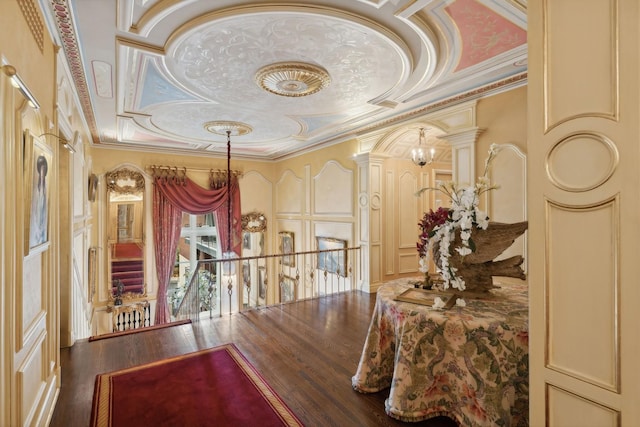 1355 N Astor St, Chicago, IL 60610 - hallway with crown molding, a decorative wall, ornate columns, and wood finished floors