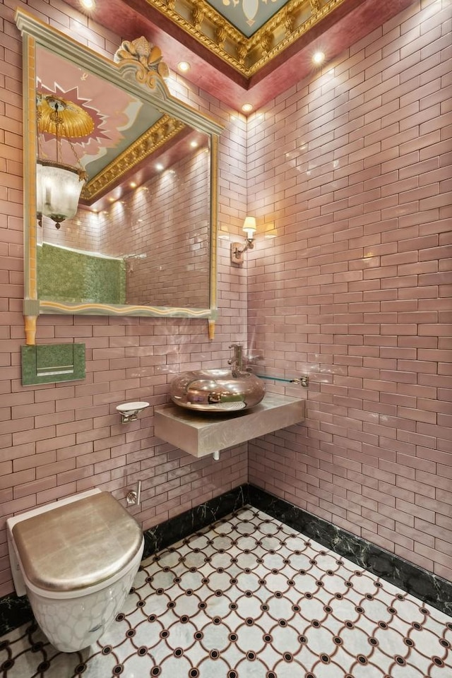 1355 N Astor St, Chicago, IL 60610 - half bathroom with toilet, tile walls, and a sink