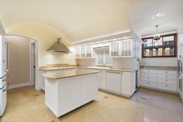 1355 N Astor St, Chicago, IL 60610 - kitchen with glass insert cabinets, a sink, extractor fan, white cabinetry, and light countertops