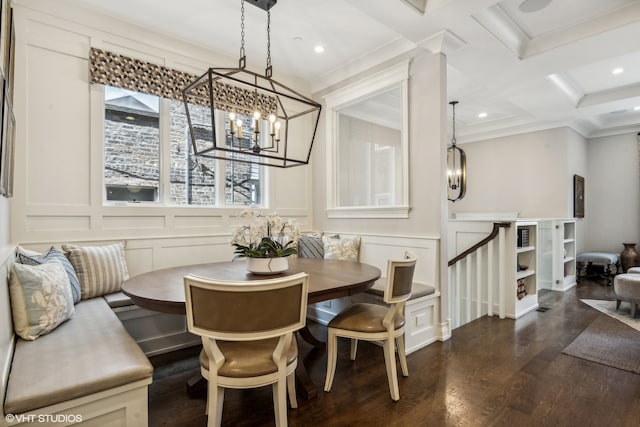 dining area featuring ornamental molding, breakfast area, beamed ceiling, dark wood-type flooring, and coffered ceiling