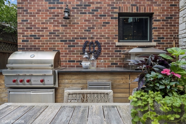 view of patio / terrace with an outdoor kitchen and area for grilling