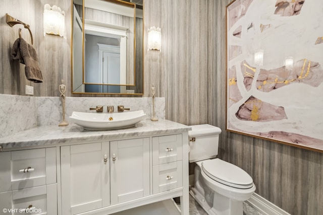 bathroom featuring toilet and vanity