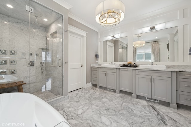 bathroom with vanity, a chandelier, shower with separate bathtub, and ornamental molding