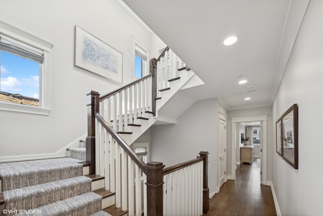 stairway featuring hardwood / wood-style flooring and ornamental molding