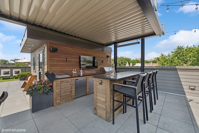 view of patio / terrace featuring exterior bar