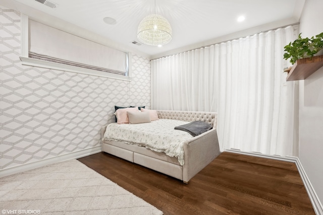 bedroom with dark wood-type flooring