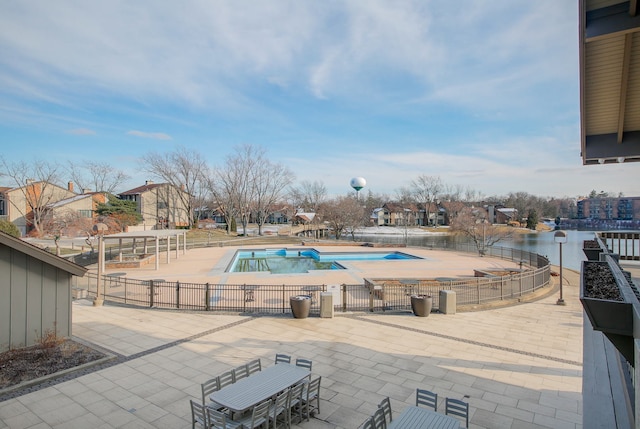 pool featuring a patio and fence