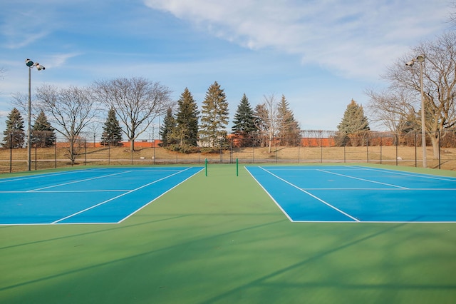 view of sport court with fence