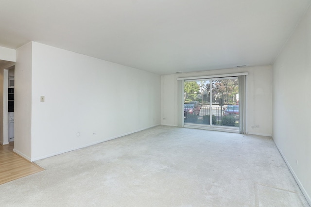 empty room with baseboards