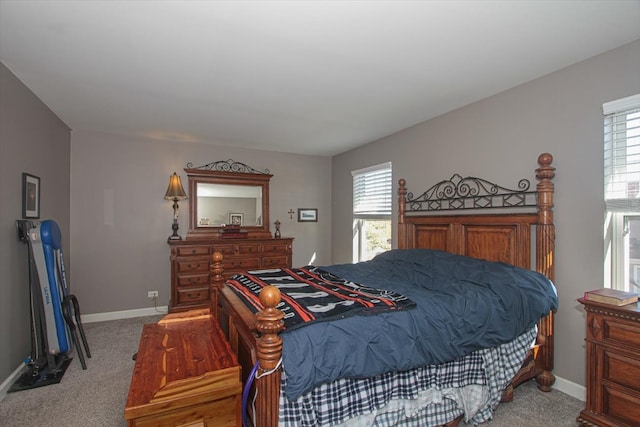 bedroom featuring carpet flooring and multiple windows