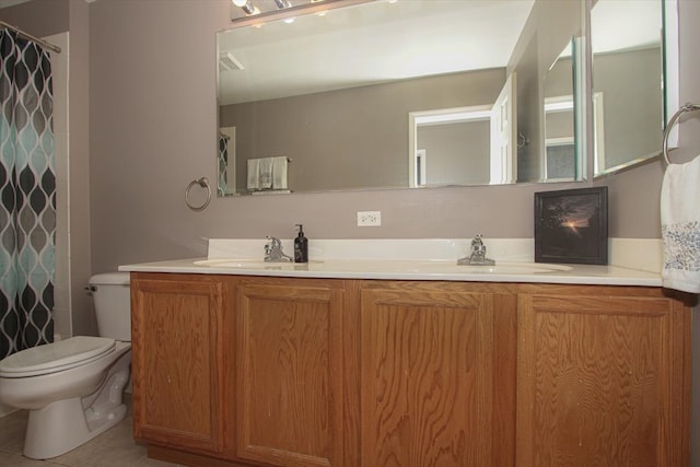 bathroom with vanity, a shower with curtain, toilet, and tile patterned floors