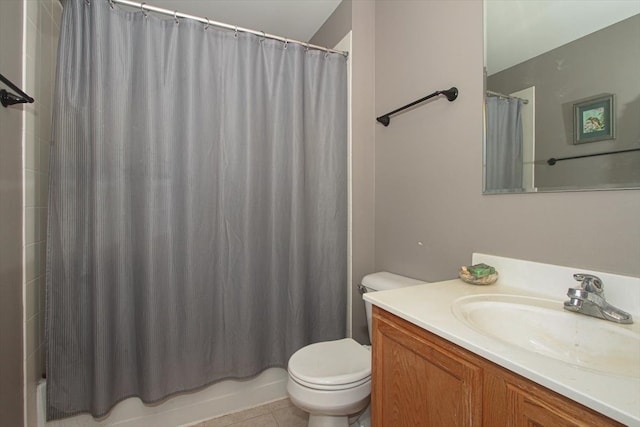 full bathroom featuring vanity, shower / bath combo with shower curtain, toilet, and tile patterned floors