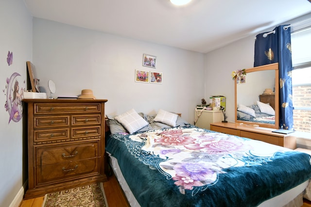 bedroom with light hardwood / wood-style flooring