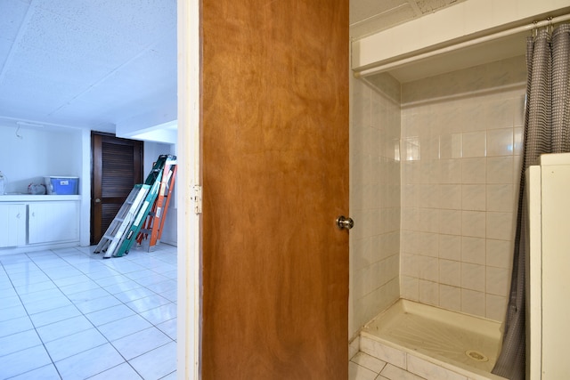 bathroom featuring tile patterned floors and a shower with curtain