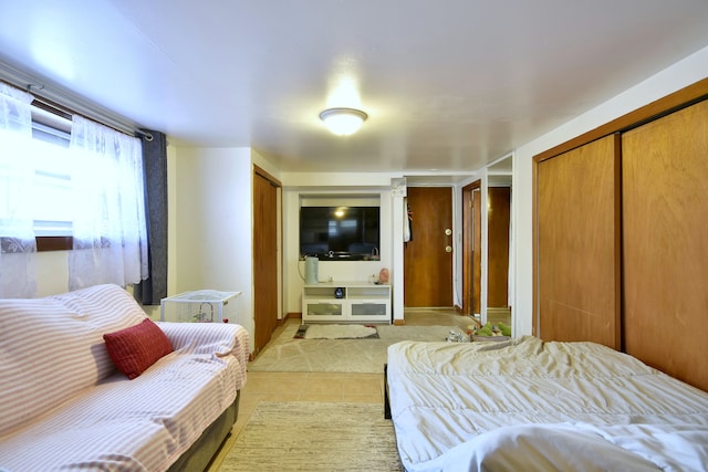 bedroom featuring light tile patterned floors