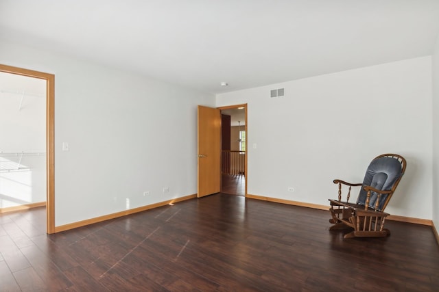 sitting room with dark hardwood / wood-style floors