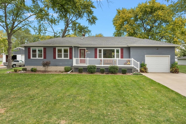 single story home featuring a front lawn and a garage