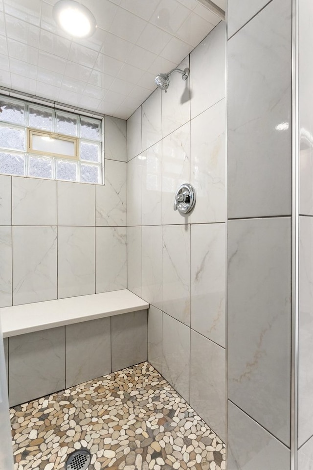 bathroom with tiled shower