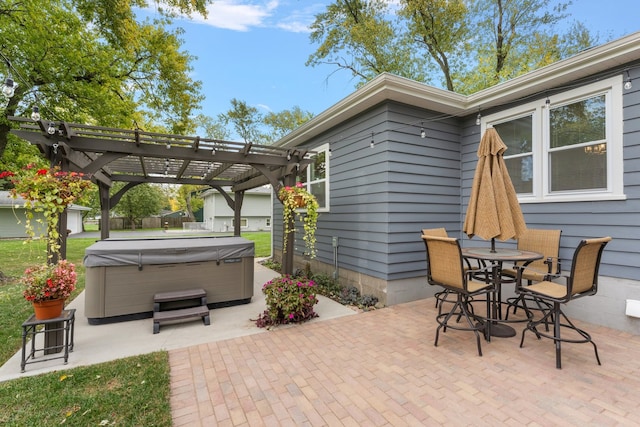 view of patio featuring a hot tub and a pergola