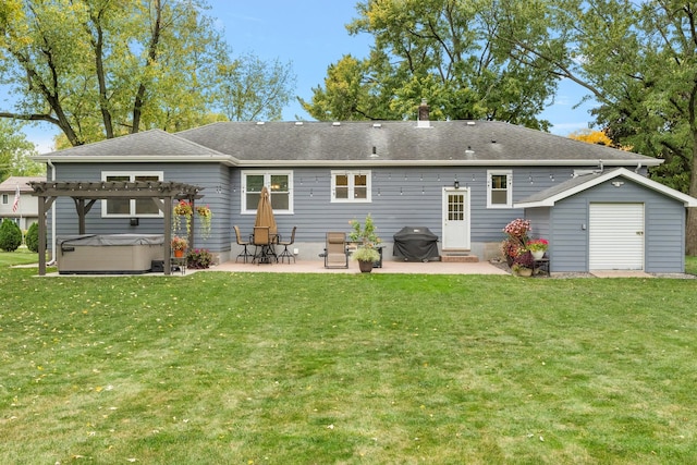 back of house featuring a yard, a patio, and a pergola