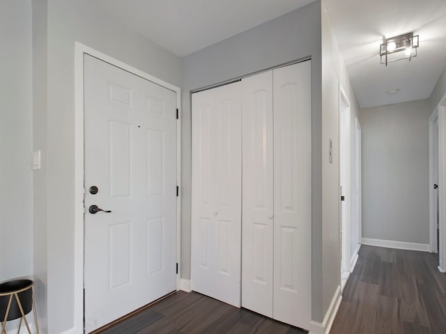 foyer with dark hardwood / wood-style floors