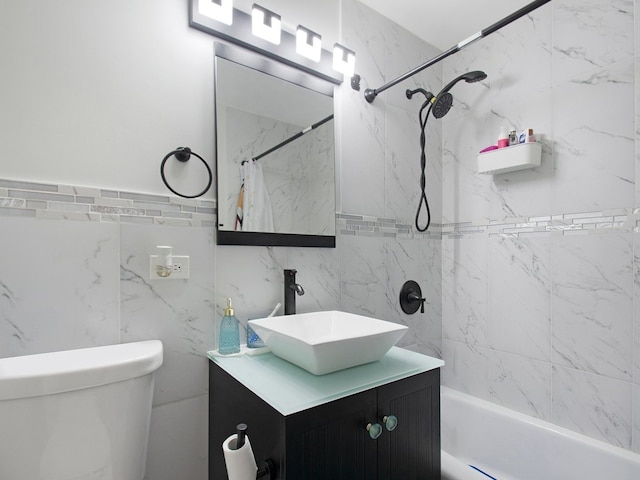 full bathroom featuring tile walls, vanity, shower / bath combo with shower curtain, and toilet