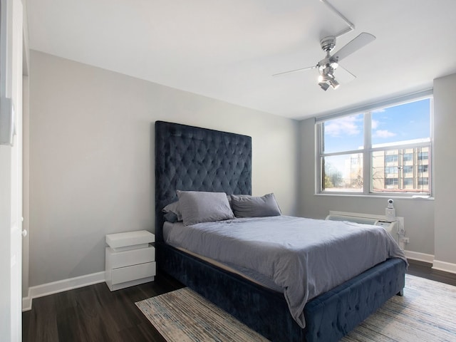 bedroom featuring dark wood-type flooring and ceiling fan