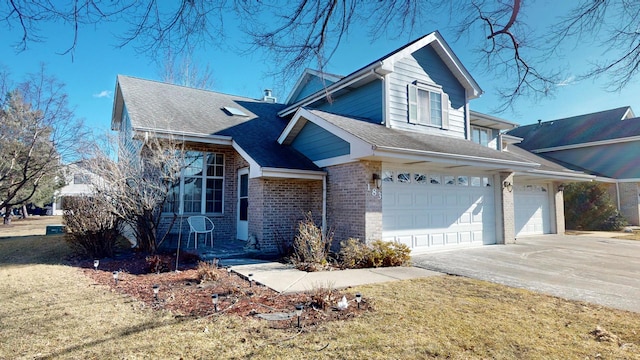 view of front of house featuring a garage and a front lawn