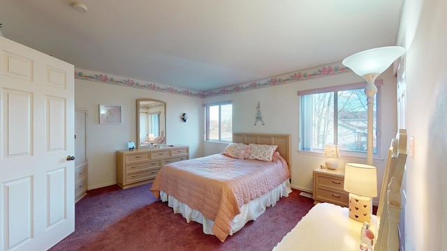 bedroom featuring dark carpet