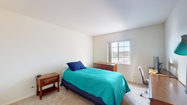 bedroom with light colored carpet