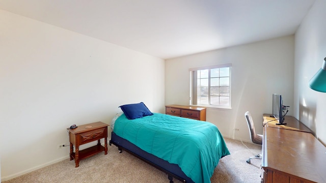 bedroom featuring light colored carpet