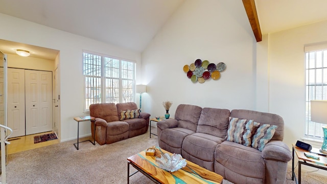 living room featuring lofted ceiling with beams and light carpet