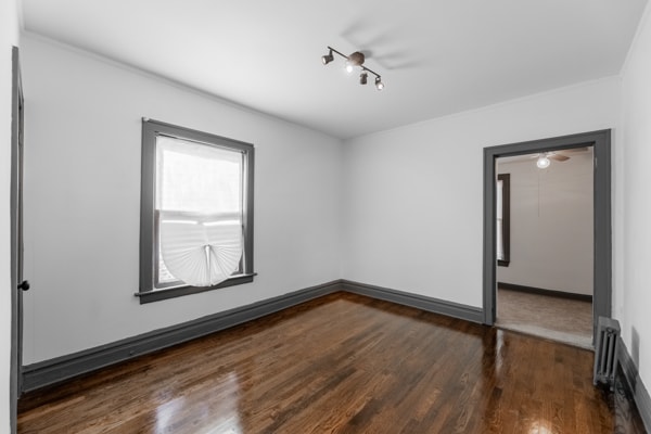 spare room featuring dark hardwood / wood-style floors