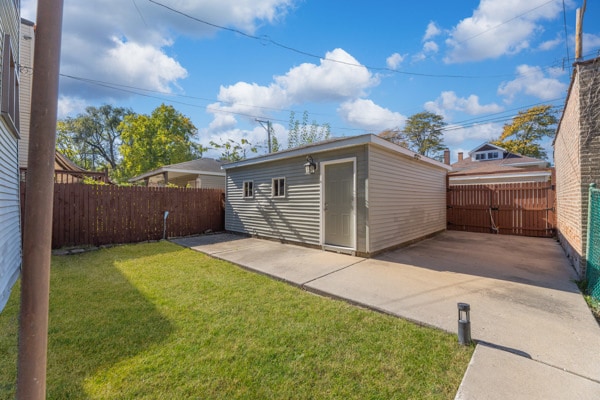 view of outbuilding with a lawn