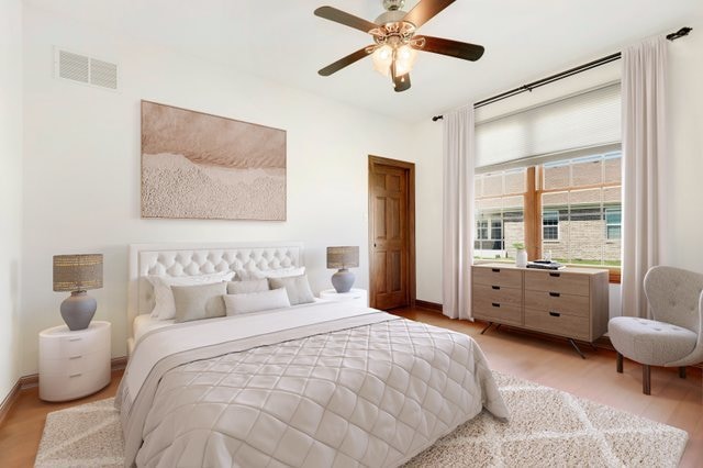 bedroom featuring light hardwood / wood-style floors and ceiling fan