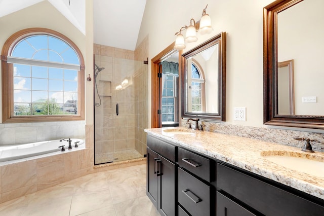 bathroom with vanity, shower with separate bathtub, tile patterned floors, and vaulted ceiling