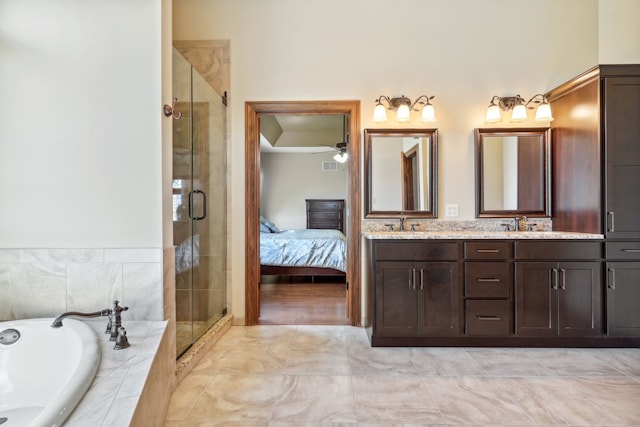 bathroom with vanity, ceiling fan, and separate shower and tub