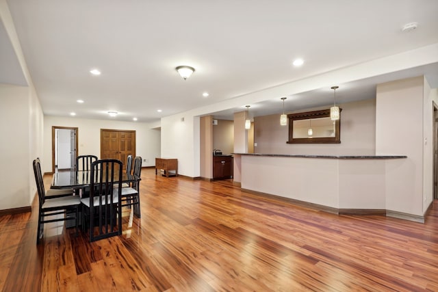 dining room with wood-type flooring