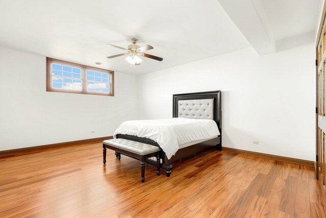 bedroom with light hardwood / wood-style floors and ceiling fan