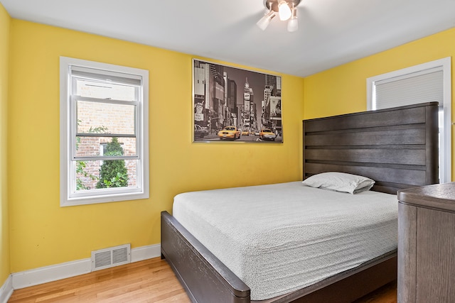 bedroom featuring light wood-type flooring and ceiling fan