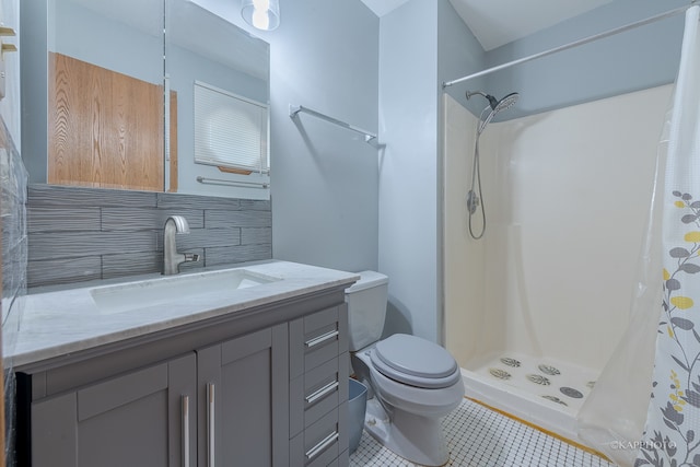 bathroom with decorative backsplash, toilet, vanity, a shower with shower curtain, and tile patterned flooring