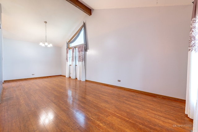 empty room with vaulted ceiling with beams, an inviting chandelier, and wood-type flooring