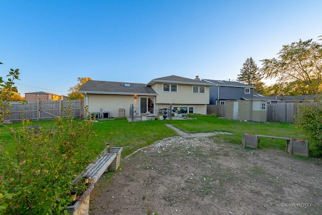 back of house with a patio area, a yard, and central AC unit