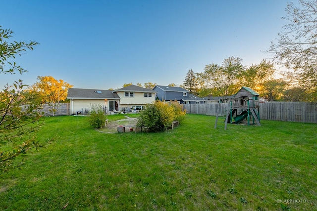 yard at dusk with a playground