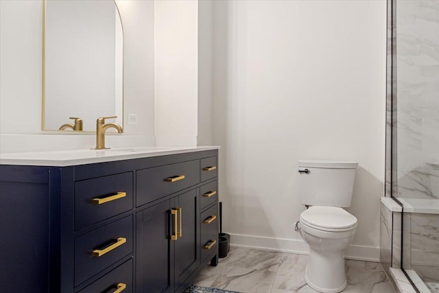 bathroom with a marble finish shower, vanity, marble finish floor, baseboards, and toilet