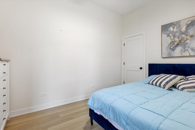 bedroom featuring light wood-style floors and visible vents