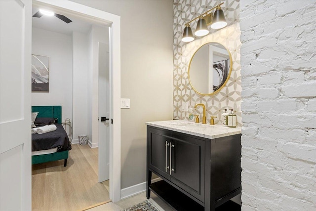bedroom featuring light wood-type flooring and baseboards