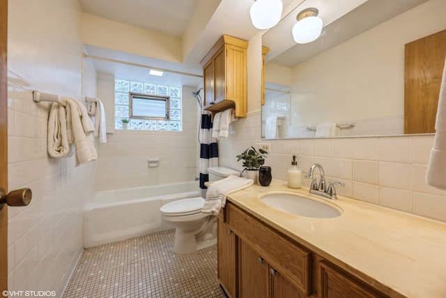 full bathroom featuring tasteful backsplash, shower / bath combination with curtain, vanity, tile patterned flooring, and toilet