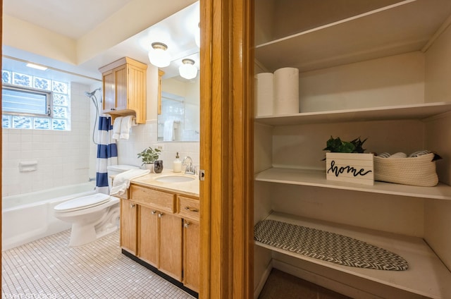 full bathroom featuring tile patterned floors, toilet, tasteful backsplash, vanity, and shower / bath combination with curtain