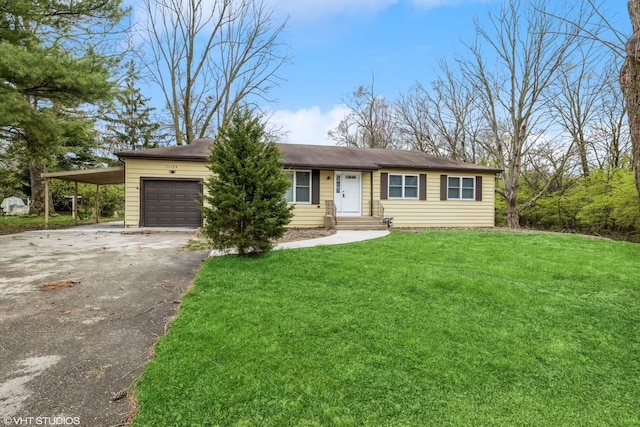 single story home featuring a garage, a front lawn, and a carport